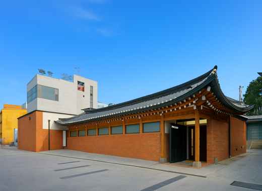 Hakgojae Gallery in Bukchon Hanok Village, Seoul, featuring a modern hanok-style building under clear blue sky