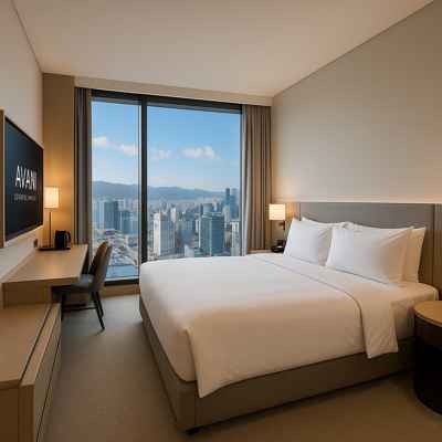 Modern guest room at Busan hotel Avani Central Busan with city view and minimalist interior design