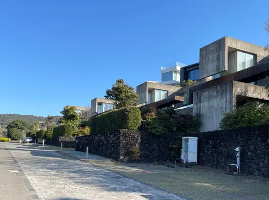 Exterior view of Bayhill Pool & Villa in Jeju with modern architecture and clear sky