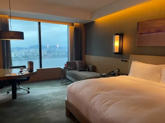 Conrad Seoul premium room with a panoramic Han River view and warm ambient lighting