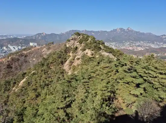 Mountain ridge view on Inwangsan Course 1 overlooking Seoul on a clear day.