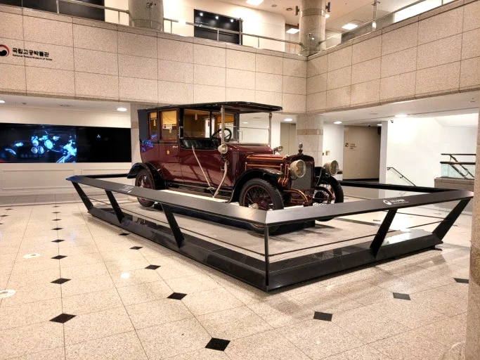Vintage royal automobile displayed at the National Palace Museum of Korea in the main exhibition hall.
