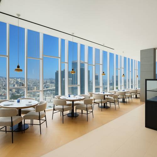 Dining area at Novotel Ambassador Seoul Dongdaemun with a panoramic city view

