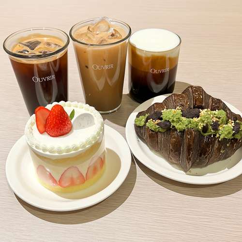 Ouvrir Bakery Seoul cafe dessert table with strawberry shortcake, matcha croissant, and iced coffee drinks, popular spot near Sejong Hotel Myeongdong