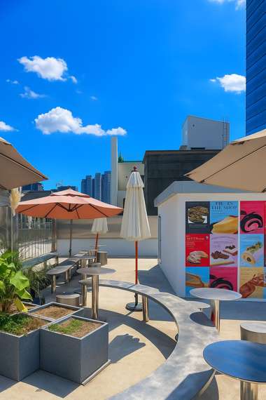 Rooftop seating area of Pie in the Shop café in Yongsan, Seoul, under a bright blue autumn sky with parasols and modern tables.