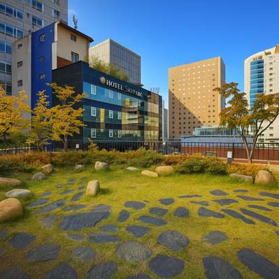 Autumn city view near Savoy Hotel Myeongdong in Seoul, showing golden trees, blue sky, and modern buildings around the hotel