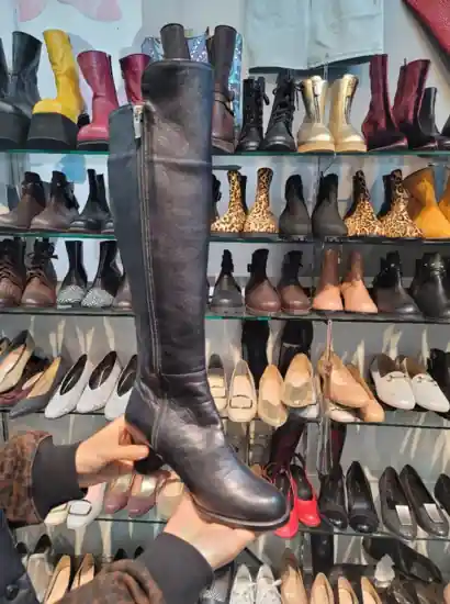 A pair of handmade leather boots displayed at a shoe shop in Seongsu, Seoul — Seongsu travel atmosphere.