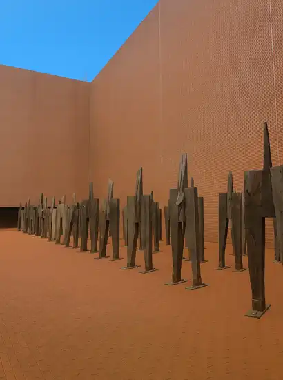 Art installation in the courtyard of Seosomun Shrine History Museum with blue sky and red brick walls in Seoul