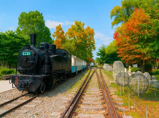Seoul Dulle-gil Course 3 Bukhansan Hwarangdae Railway Park with restored black steam train on vintage tracks