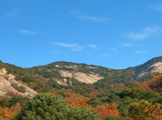 eoul Dulle-gil Course 3 Bukhansan mountain view with clear blue sky and light autumn foliage