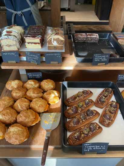 Freshly baked pastries and desserts displayed at a bakery near the Seoul Trail 7 Course Iljasan, including breads, cakes, and seasonal treats.