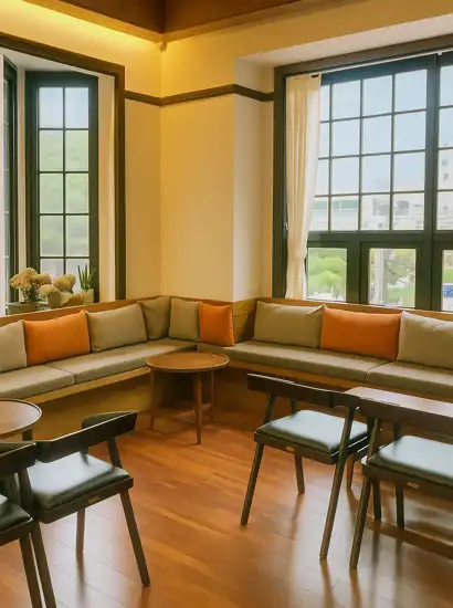 Interior of The House 1932, a popular Seoul cafe with wooden floors, large windows, and cozy seating