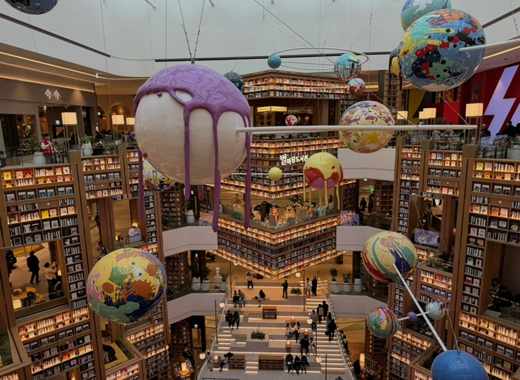 Starfield COEX Mall Starfield Library interior with colorful planet art installation and bright open atmosphere.

