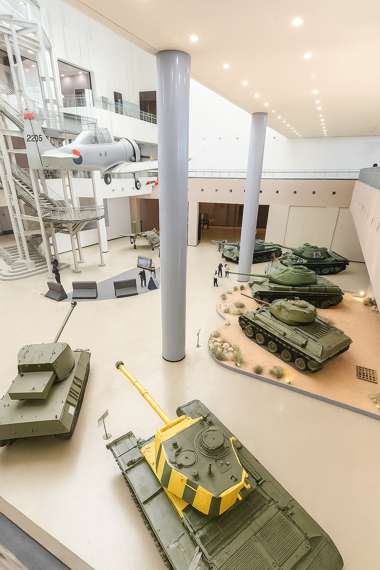 Interior view of the War Memorial of Korea in Seoul, showing tanks and aircraft on display inside the exhibition hall.