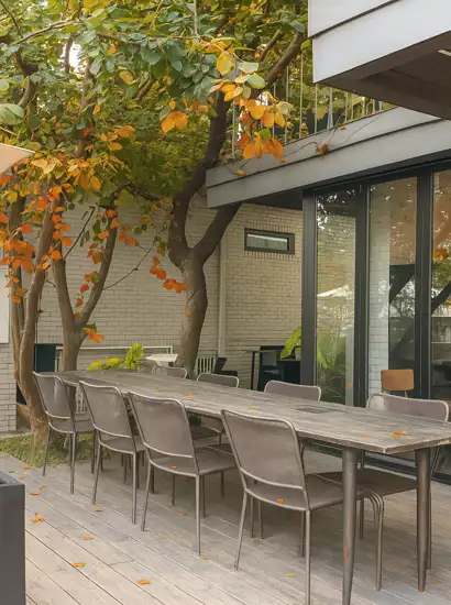 Outdoor café terrace near Yongsan Family Park with light autumn foliage and rustic wooden seating in Seoul