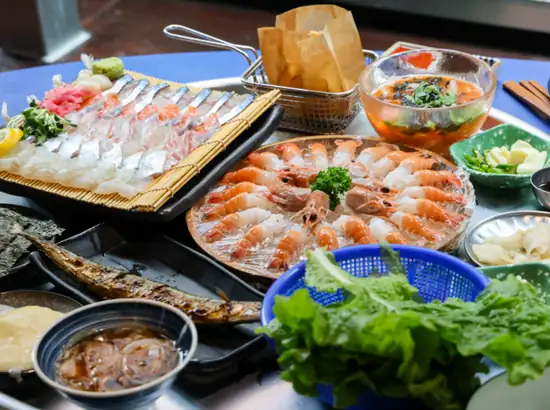 Seafood platter with sashimi and shrimp, popular meal stop for an aewol jeju itinerary in Jeju