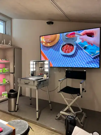 Makeup demonstration area inside Amore Seongsu, featuring a vanity station, chair, and display screen for the Amore Seongsu K-Beauty Makeup Class.