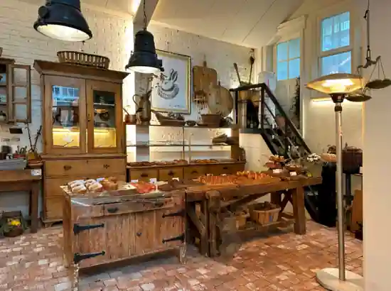 Interior of a rustic bakery cafe on the Apgujeong Rodeo cafe tour with bread displays and warm vintage decor