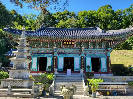 Bulguksa-style Buddhist temple along the Daemosan Forest Trail in Gangnam Seoul, surrounded by greenery.