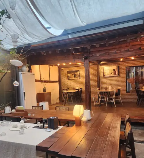 ddp cafe and tea hanok-style tea café interior with wooden tables and warm lighting near Dongdaemun