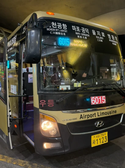 Incheon Airport to Myeongdong Airport Bus 6015 parked at Incheon Airport with route display showing Mapo and Namdaemun