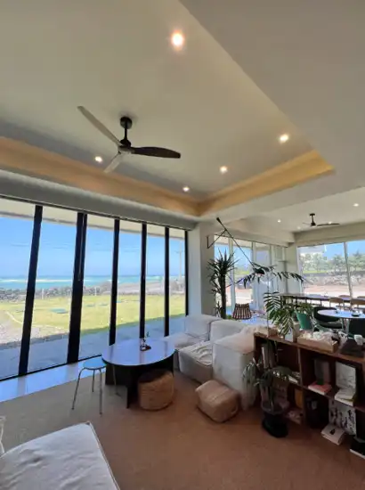 Interior of Glossy Matcha Café with ocean view near Jeju Hamdeok Beach, captured for the Jeju Hamdeok Beach Travel Guide.
