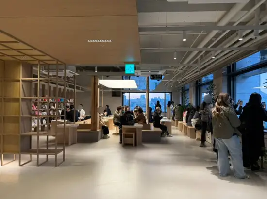 Indoor cafe seating area filled with visitors enjoying the view during the Jeongdong Observatory visit guide experience