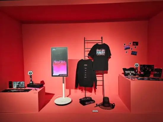 K-Pop Demon Hunters Pop-Up Store black merchandise display featuring apparel, accessories, and themed promotional items arranged in Seoul venue