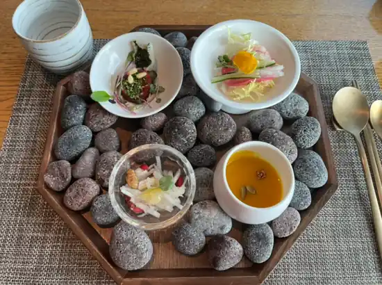 Korean starter set served on warm stones at HANCOOK in N Seoul Tower, useful dining photo for n seoul tower tickets planning
