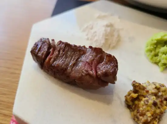 Premium Korean beef served along Seoul Dullegil Course 18 dining route at Bukakjeong, grilled medium and paired with mustard and salt.