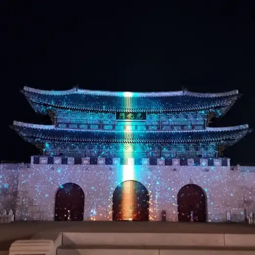 Night view of Seoul Light Gwanghwamun with projection mapping displayed over the traditional gate façade during the winter festival
