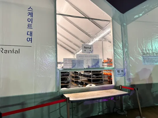 Skate rental counter at the Seoul Plaza Ice Rink, showing rental shelves and ticket information for visitors