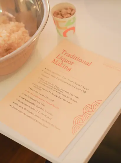 Seoul traditional liquor making experience showing hands-on makgeolli preparation at The Sool Gallery in Bukchon