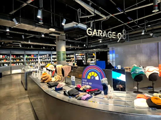 Garage 981 gift shop interior at 9.81 PARK JEJU, with souvenirs and gear on display