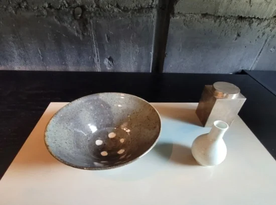 Ceramic bowl and small vase display on a table in Hannam-dong, Seoul