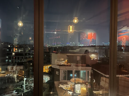 Night skyline view through a cafe window in Seoul
