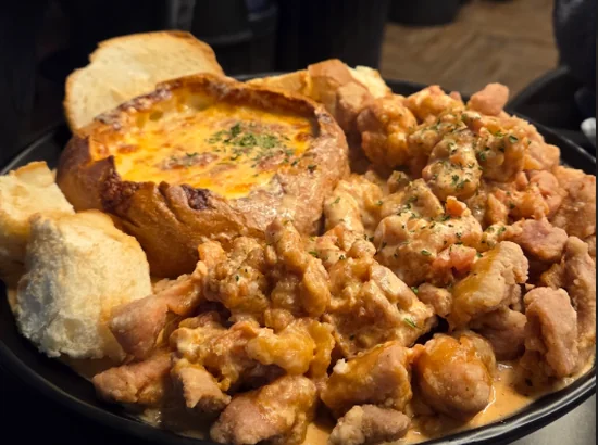 Kkokgeudak signature fried chicken served in a bread bowl, featured as a gangnam korean fried chicken menu item