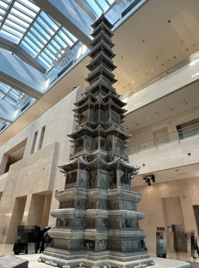 Gyeongcheonsa Ten-Story Stone Pagoda in the Path of History gallery at the National Museum of Korea, viewed from below under a skylight.
