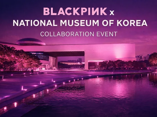 National Museum of Korea BLACKPINK collaboration pink lighting at dusk with the museum exterior glowing in pink.