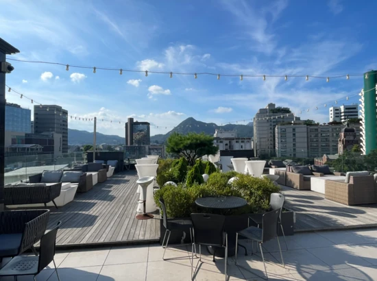 Outdoor terrace at Le France Rooftop, a seoul jongno view cafe with open seating and city views