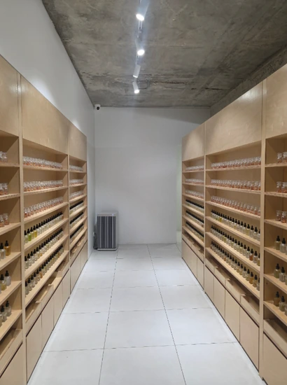Interior shelves at Dot Note in Seongsu lined with fragrance bottles and blending materials