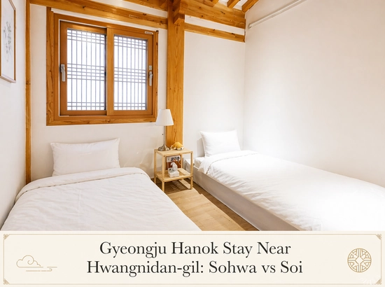 Twin room at Sohwa Hanok in Gyeongju, featuring two single beds, a traditional wooden window, and a bright, clean interior